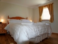 Master bedroom in Curlew cottage
